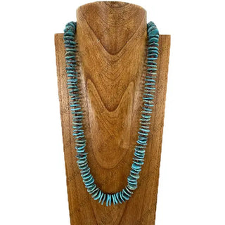28-inch blue-green flat turquoise stone nugget beaded necklace displayed on wooden jewelry bust form.