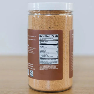 Clear jar of beef bouillon powder showing nutrition facts label, brown seasoning blend, 198 servings, 10 calories per teaspoo