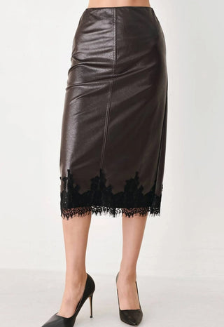 Dark brown faux leather midi pencil skirt with black lace trim hem detail, styled with black heels.