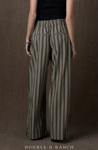 Wide-leg striped pants in olive, black, and cream with elastic waistband and back patch pockets.