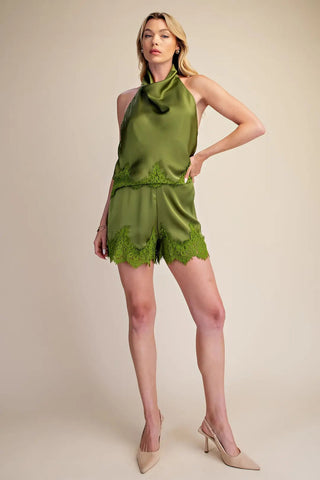 Olive green satin shorts with scalloped lace trim detail, paired with matching halter top.