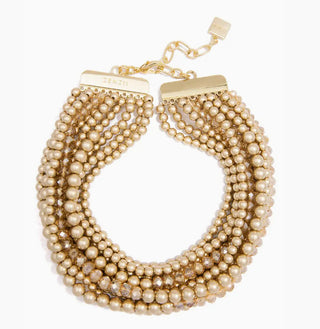 Multi-strand matte gold beaded collar necklace with crystal accents and gold-tone bar clasp by ZENZII.