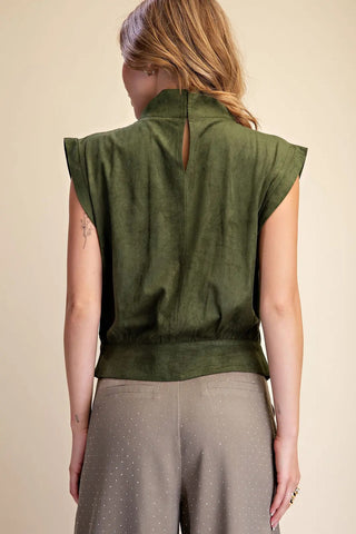 Olive green sleeveless suede top with high neck, keyhole back, and structured shoulders.