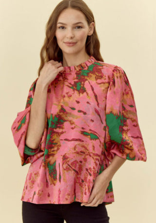 Abstract print top with feminine frilled neck