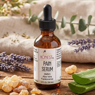 Amber dropper bottle of Simply Honest Co. Pain Serum with DMSO, Aloe Vera, and Frankincense, surrounded by lavender, frankinc