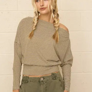 Tan and black striped off-shoulder long sleeve knit top paired with olive cargo pants.