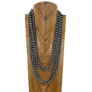 Six-strand silver Navajo pearl beaded necklace set displayed on wooden jewelry bust, varying lengths.