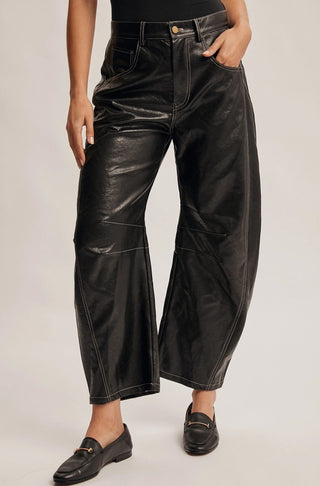 Black faux leather wide-leg pants with contrast stitching, barrel fit, and gold hardware button.