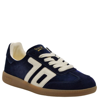 Navy blue velvet low-top sneaker with cream side stripes, gum sole, and gold "Back 70" branding detail.