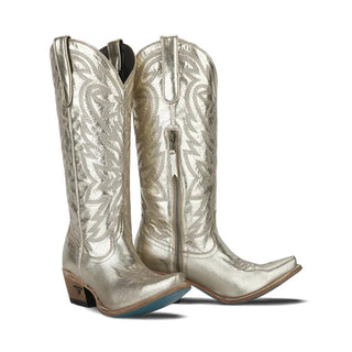Tall champagne metallic cowboy boots with intricate embroidery, pointed toe, block heel, and side zipper.