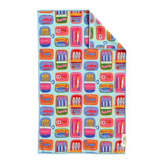 Colorful light blue hand towel printed with vibrant sardine tin illustrations in pink, orange, and purple.