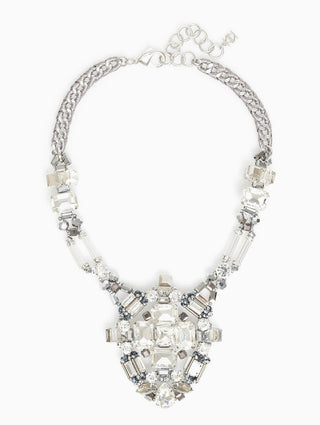 Silver statement necklace featuring a large crystal medallion pendant with clear and gray rhinestones on a chunky chain.
