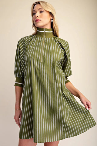 Olive green and white striped mini dress with mock neck, half-zip closure, and puff sleeves.