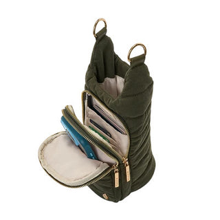 Forest green corduroy sling bag open showing interior card slots, teal phone, and gold zipper hardware.