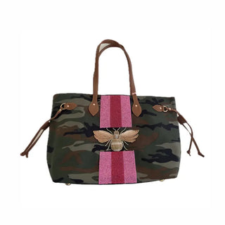 Olive camouflage tote bag with pink beaded stripe, gold bee emblem, and brown leather handles.