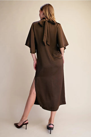 Chocolate brown satin midi dress with flutter sleeves, tie back neckline detail, and side slit.