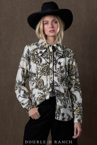 Woman wearing Double D Ranch Petro Plaid Top, cream western toile print with black and gold details, black cowboy hat.