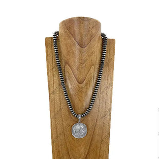 Silver Navajo pearl beaded necklace with Buffalo Indian Head coin pendant on wooden display bust.