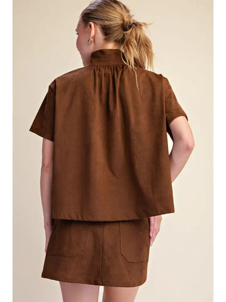 Brown suede-look stand collar short sleeve shirt with gathered back detail, styled as a matching set.