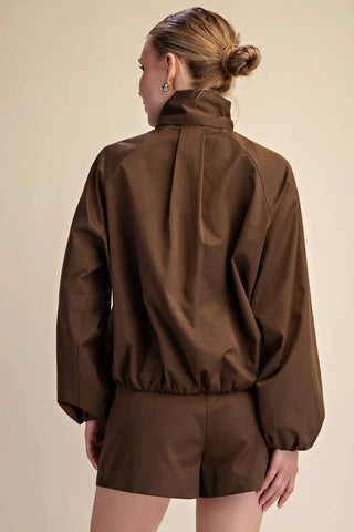 Chocolate brown scarf collar puffy jacket with long balloon sleeves and elastic hem, back view.