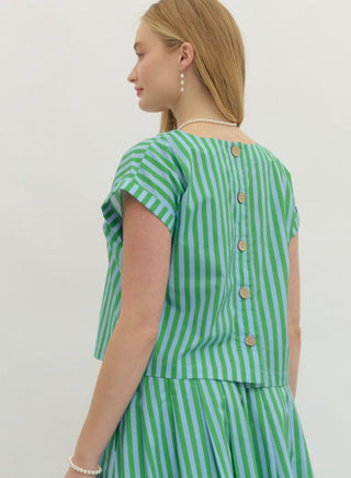 Green and blue striped short sleeve crop top with wooden button back closure, worn with matching skirt.