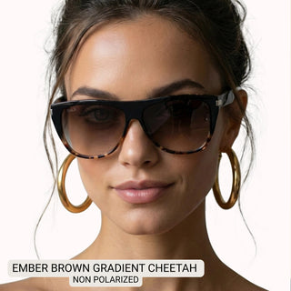 Oversized square sunglasses in black and tortoise cheetah frames with brown gradient lenses, worn by woman with gold hoop ear