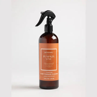 Amber spray bottle with orange label, Mixture Pumpkin Vine streak-free hard surface cleaner, 16 fl oz, black trigger nozzle.