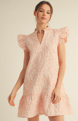 Pink floral jacquard mini dress with ruffled cap sleeves, V-neckline, and tiered ruffle hem.