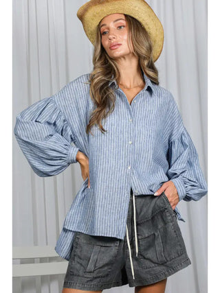 Blue and white striped oversized button-down shirt with dramatic balloon sleeves and relaxed fit.