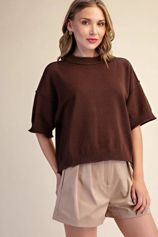 Chocolate brown relaxed knit crew-neck sweater with elbow-length sleeves and ribbed trim detailing.