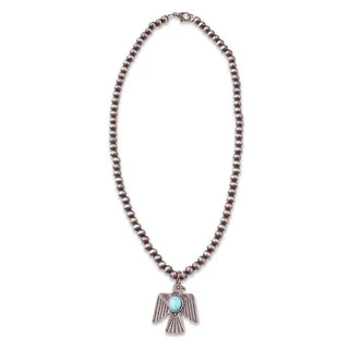 Copper beaded necklace with silver thunderbird pendant featuring oval turquoise stone centerpiece on white background.