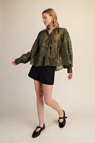 Olive green sheer leopard jacquard voluminous blouse with long balloon sleeves and button front closure.
