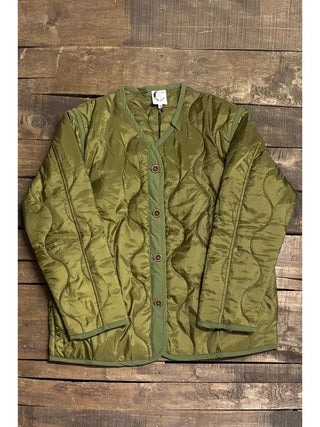 Olive green quilted jacket with button front closure, V-neckline, and long sleeves on wood surface.
