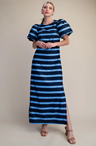 Navy and blue horizontal striped maxi dress with puff sleeves, A-line silhouette, and side slit.