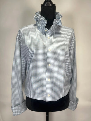 Blue and white gingham check button-up shirt with ruffled collar and rolled cuffs on dress form.