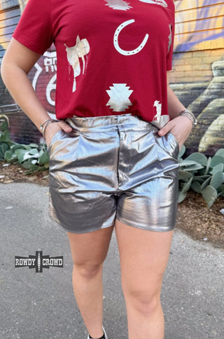 Silver metallic high-waisted shorts with side pockets, styled with a red western graphic tee.