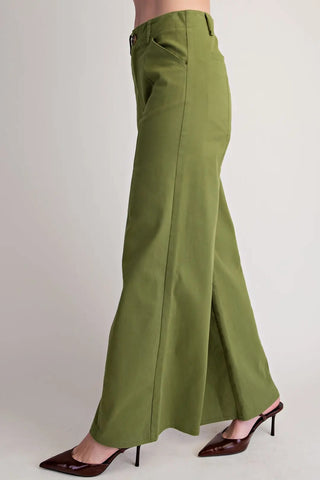 Olive green wide-leg high-waist pants with seam stitching, side pocket, paired with burgundy heels.