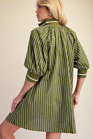 Olive green striped mini dress with mock neck half-zip, puffed sleeves, and ribbed cuffs, shown from back.