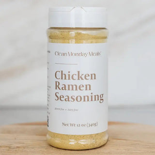 Clear jar of Clean Monday Meals Chicken Ramen Seasoning, 12oz, gluten-free, dairy-free, golden powder visible inside.