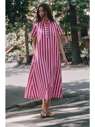 Pink and magenta striped midi shirt dress with collar, short sleeves, and button placket detail.