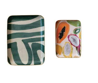 Set of two rectangular enameled metal trays with gold rims featuring abstract green pattern and colorful tropical fruit desig