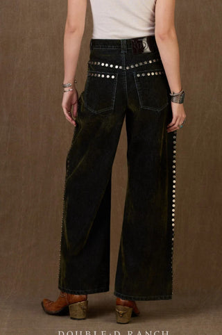 Dark green wide-leg jeans with silver stud embellishments along waistband and side seams, back view.