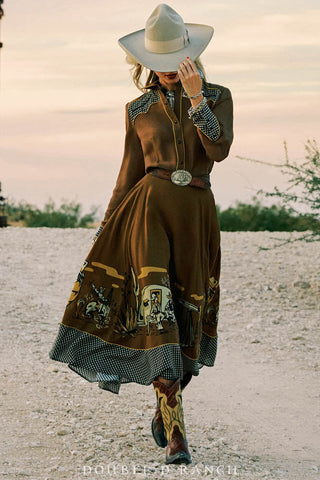 Brown western midi skirt with illustrated oil camp border print and navy gingham trim detail.