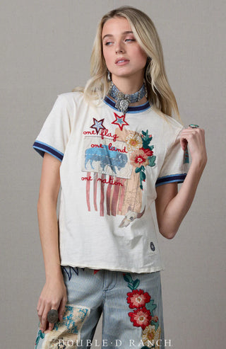 Cream short-sleeve tee with patriotic embroidery reading "one flag, one land, one nation," stars, floral appliqué, and Americ