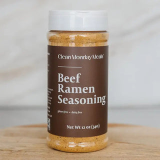Clear plastic shaker jar of Clean Monday Meals Beef Ramen Seasoning with brown label, gluten-free and dairy-free, 12 oz.