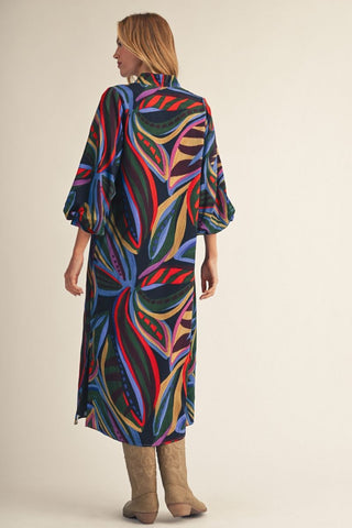 Colorful abstract floral midi dress with 3/4 puff sleeves in navy, red, green, blue, and gold tones.