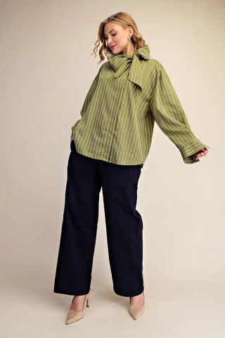 Olive green pinstripe high neck shirt with bow tie detail, oversized fit, long sleeves with cuffed hem.