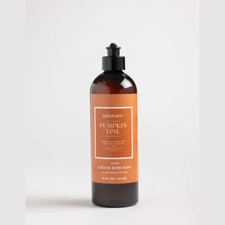 Amber glass bottle of Mixture Pumpkin Vine luxury liquid dish soap with black pump top and orange label, 16oz.