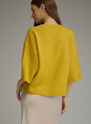 Solid ¾ sleeve sweater top featuring a round neck and ribbed trim