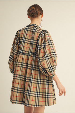 Beige and black plaid babydoll dress with red accents, puff sleeves, leather trim, and gathered waist.